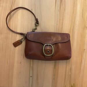 Coach Wristlet Leather Wallet. 2 openings, 1 large zippered pocket, one front po